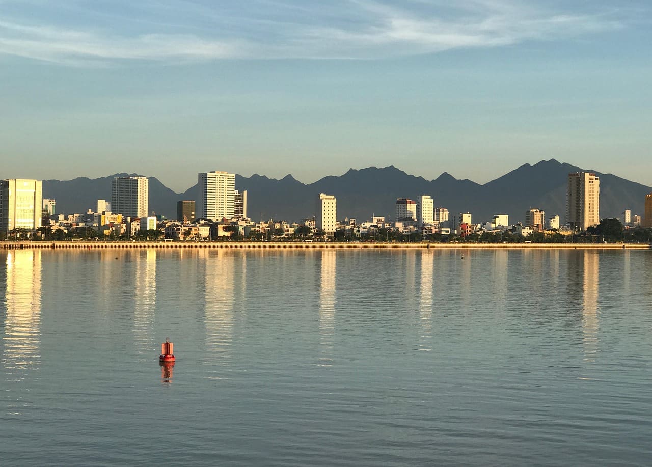 A tight 2-day Da Nang plan covering My Khe Beach, the Marble Mountains cave temples, the Dragon Bridge weekend fire show, and where to eat mi Quang.